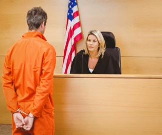 Man standing in front of a judge.